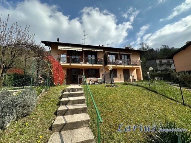 Trilocale con giardino, cantina e posto auto coperto