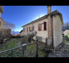 Casa con giardino